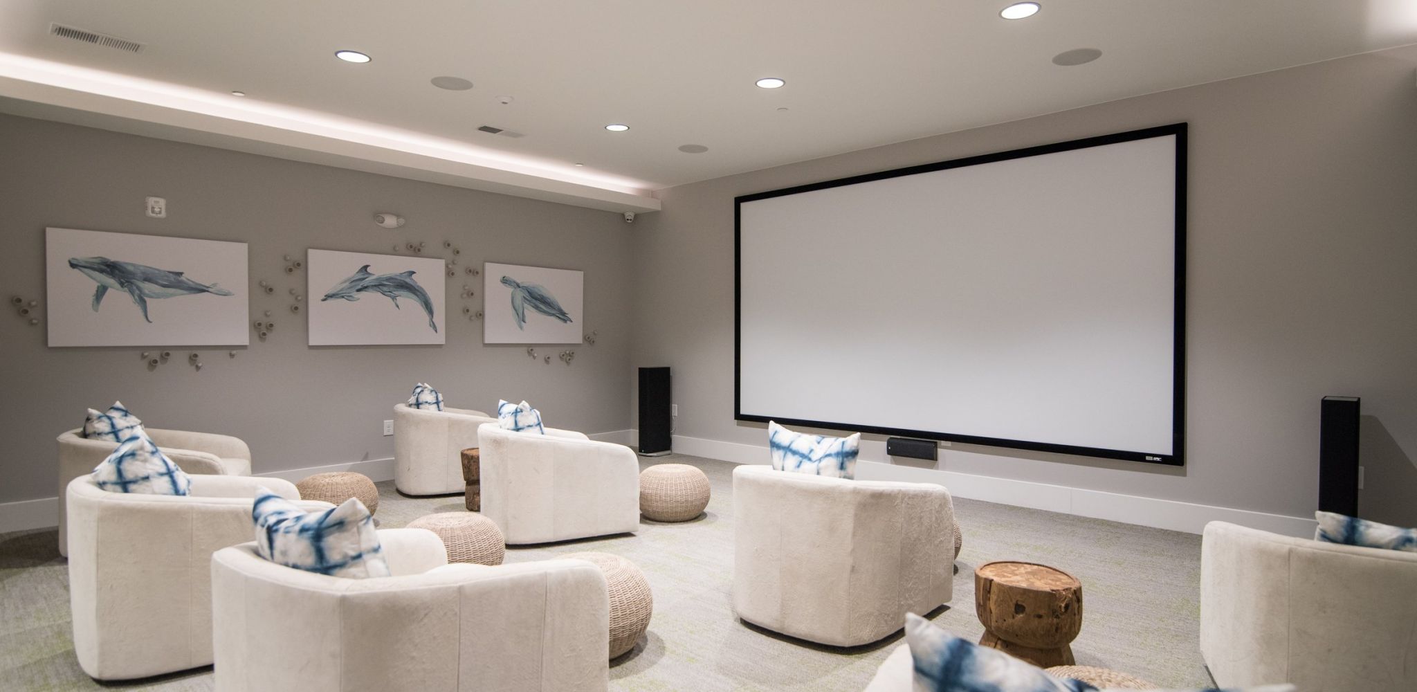 Hawthorne at Indy West state-of-the-art theater with large screen and comfortable chairs