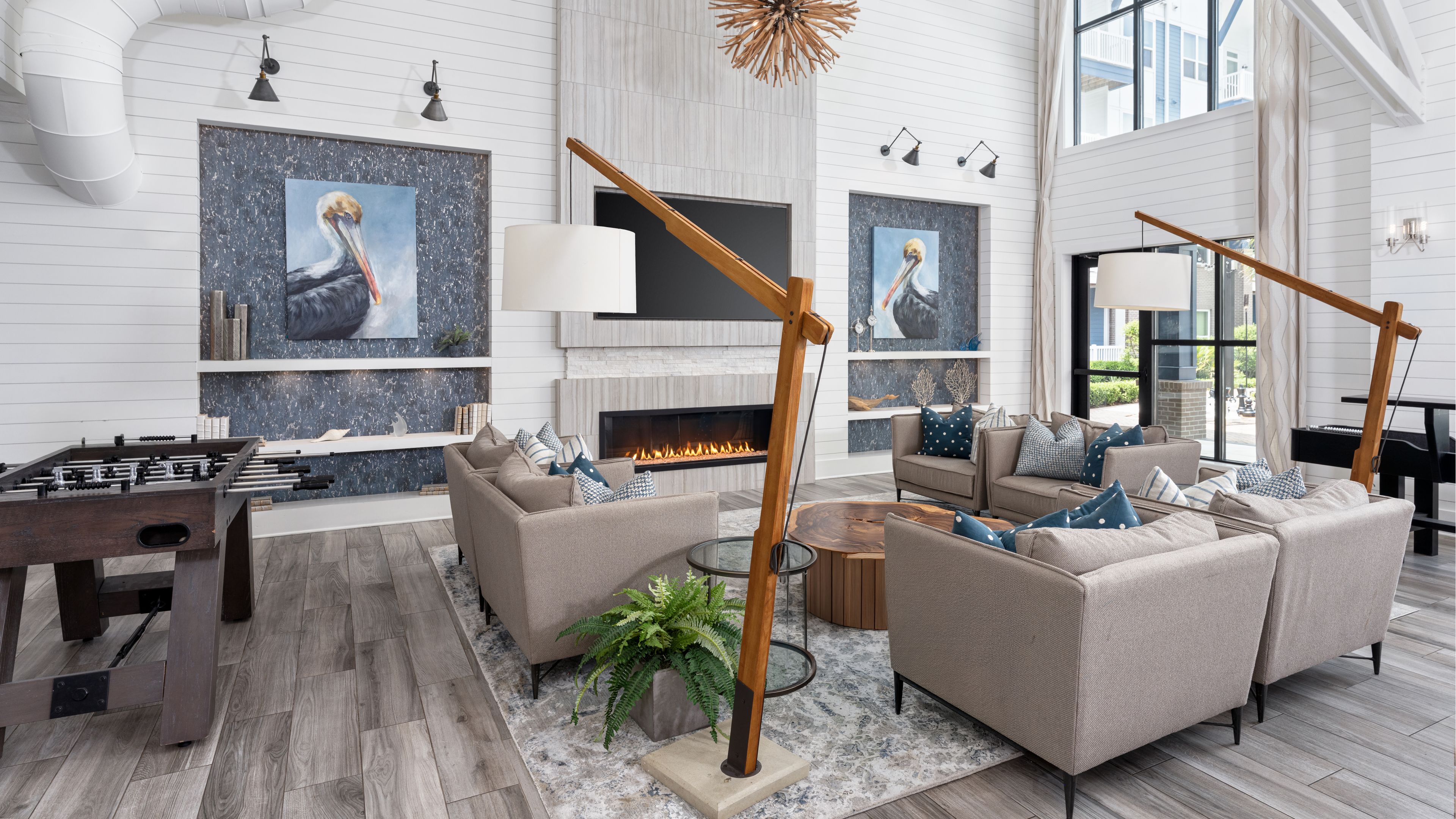 Hawthorne at Indy West beautiful outdoor courtyard with an outdoor lounge area, bocce ball court and lawn, and cabanas