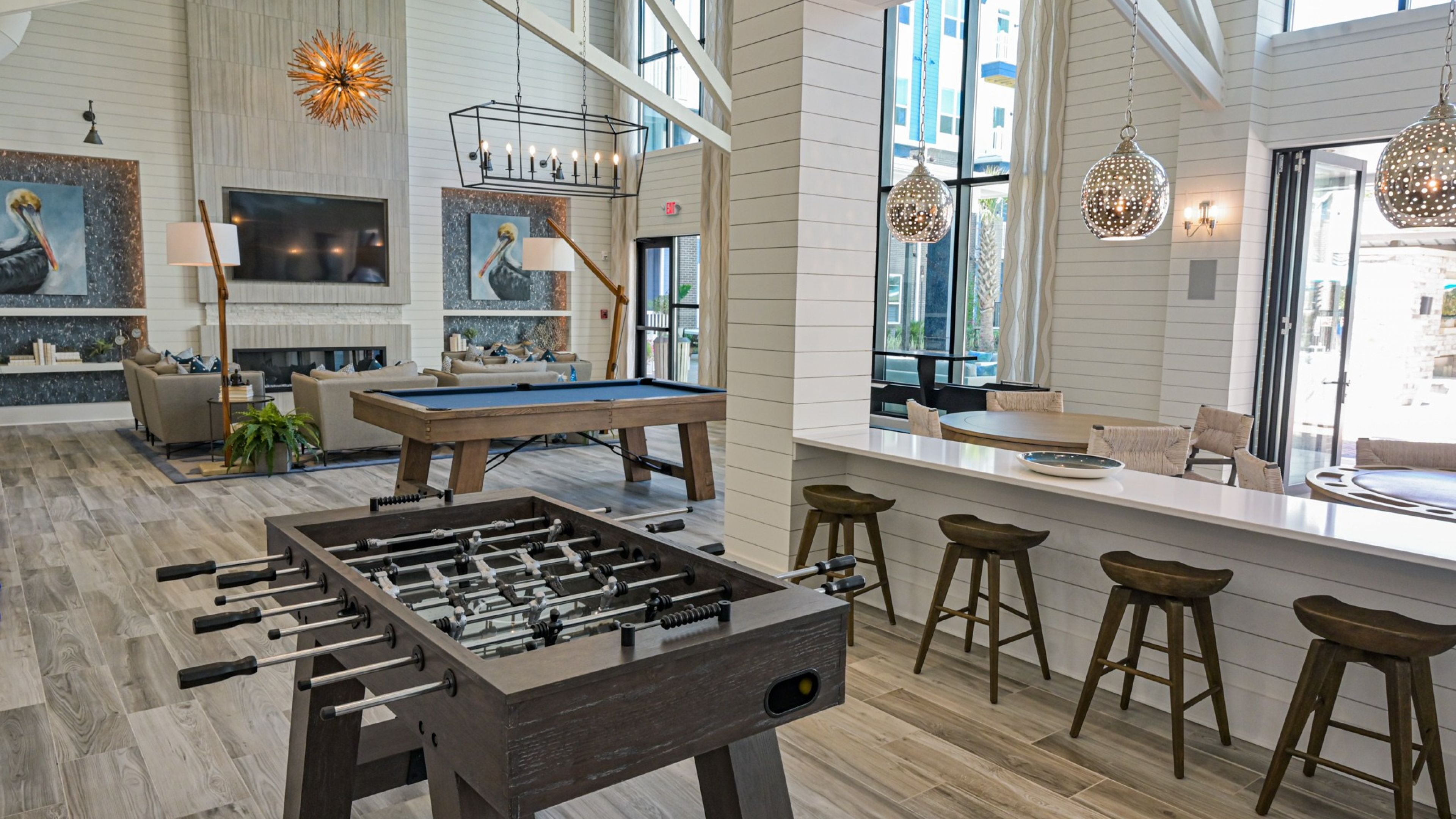 Hawthorne at Indy West resident clubhouse with pool table, foosball table, and entertainment space